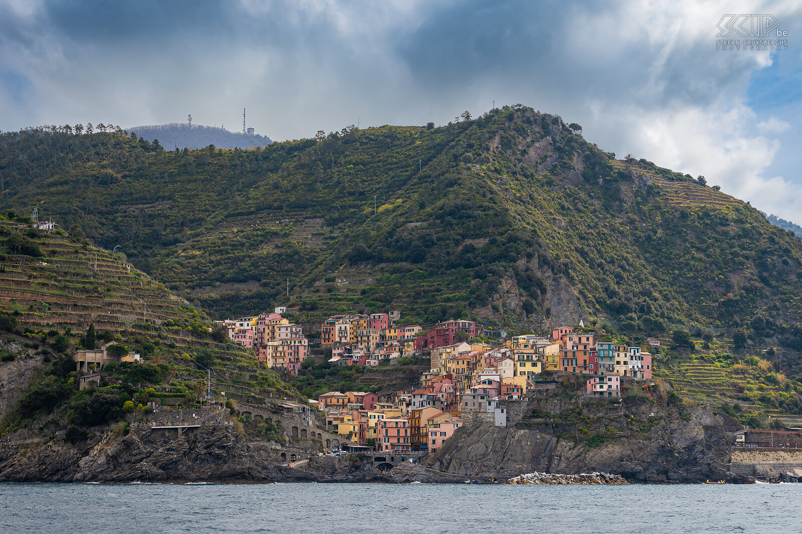 Manarola seen from sea Manarola is built on a high rock 70 meters above sea level. This beautiful village of Cinque Terre has a small harbor with a boat ramp, narrow streets with picturesque multi-colored houses overlooking the sea and many fish restaurants. Stefan Cruysberghs